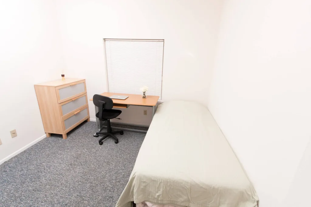 Bedroom at Campus Oaks Apartments, photo 2 of 5